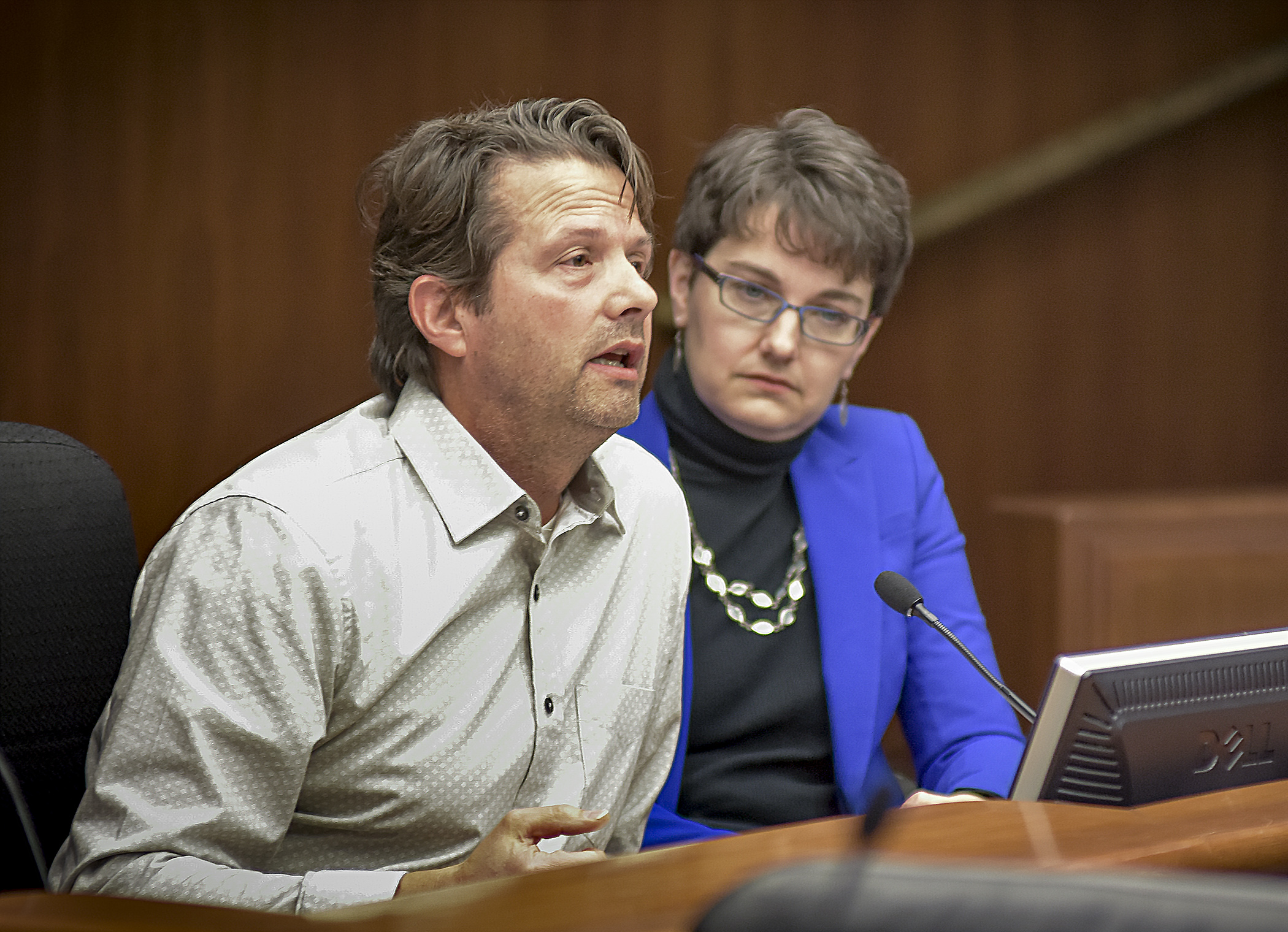 Rick Nelson, representing Loop Minnesota, and Beth Fraser, government relations director at the Commission of Deaf, Deafblind and Hard of Hearing Minnesotans, testify before the House Government Operations and Elections Policy Committee Feb. 1. Photo by Andrew VonBank